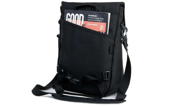 A magazine in the open-top back pocket.